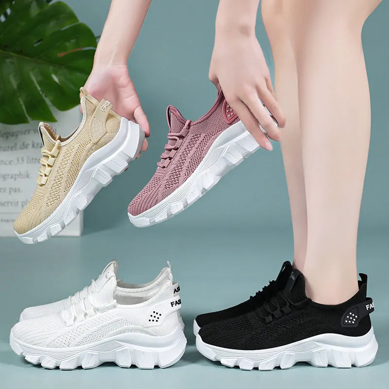Men's white Flyknit running sneakers with thick PVC sole and lace-up front.