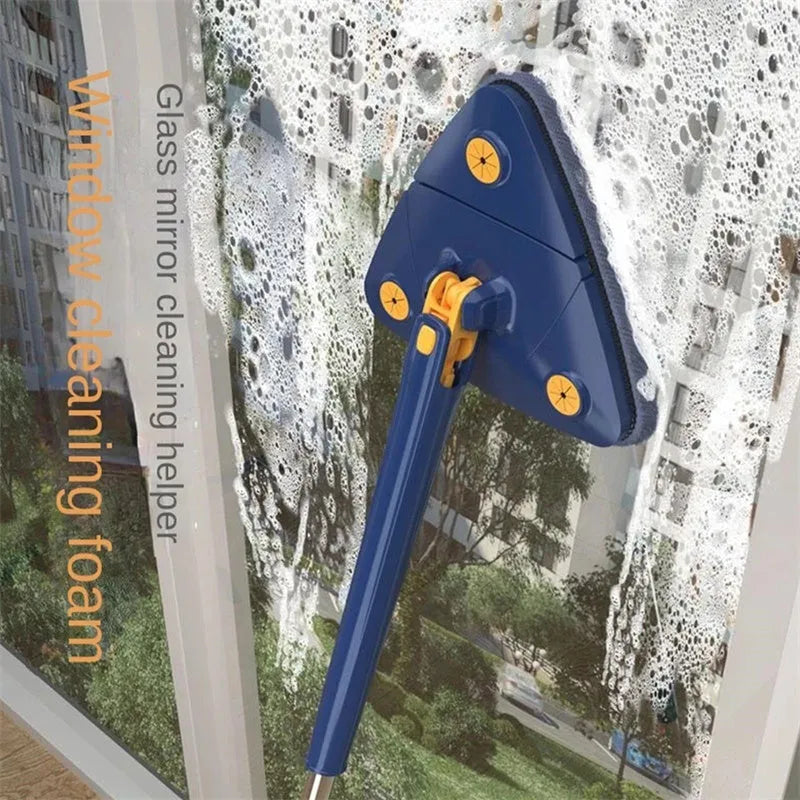 Blue extendable triangle cleaning mop with rotating head and stainless steel pole on a tiled floor.