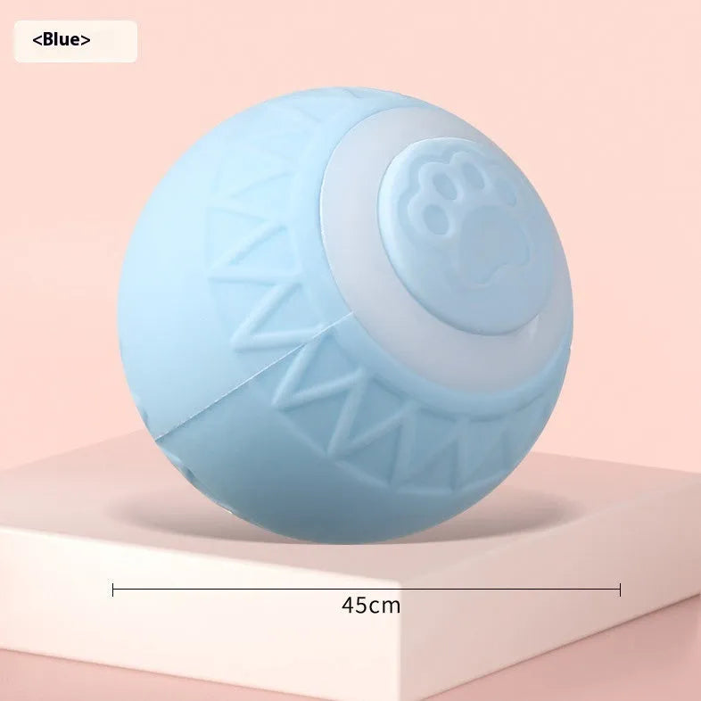 Blue and pink automatic rechargeable moving ball cat toy on a floor.