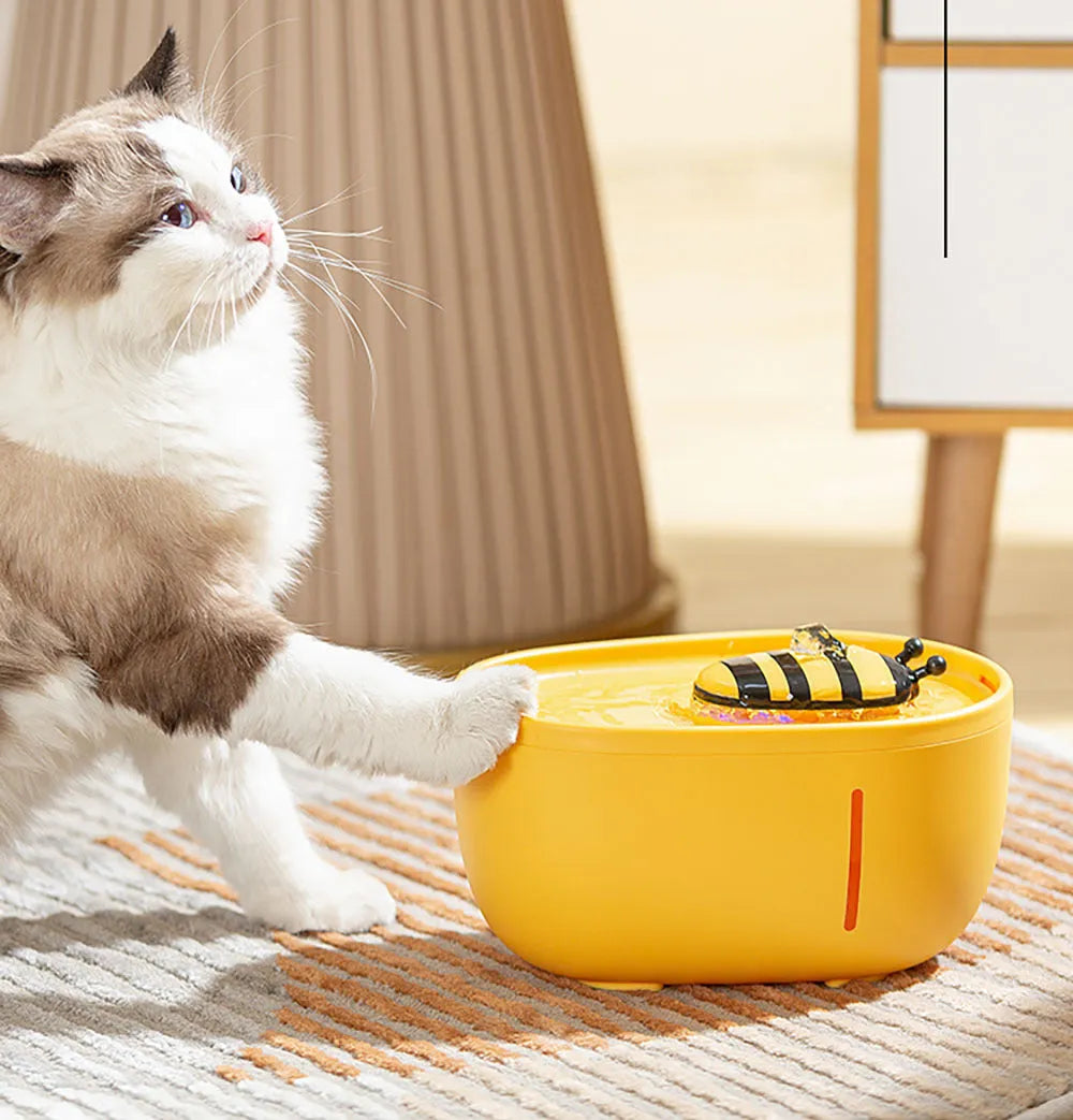 Yellow cat water fountain with filtration system, water pump, observation window, and anti-slip base
