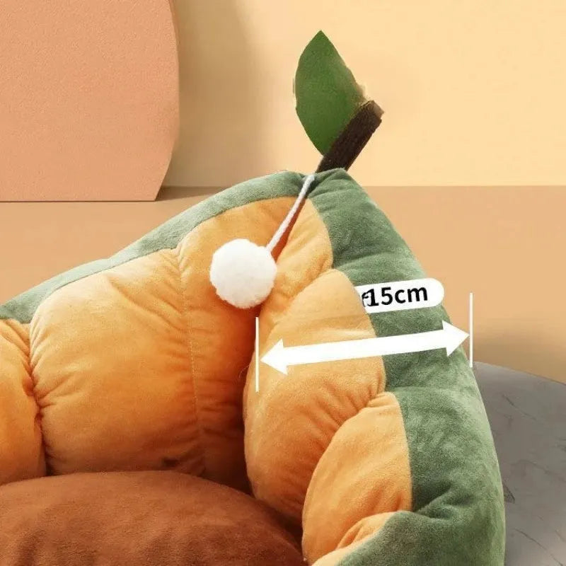 Green cotton pet bed with a plush raised rim for a cat or small dog.