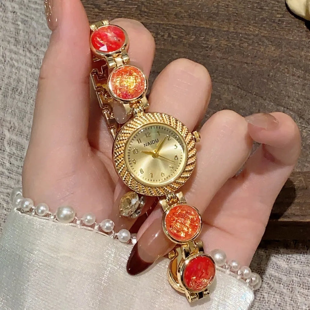 Women's quartz watch with 25mm round dial in zinc alloy case, shown in multiple colours.