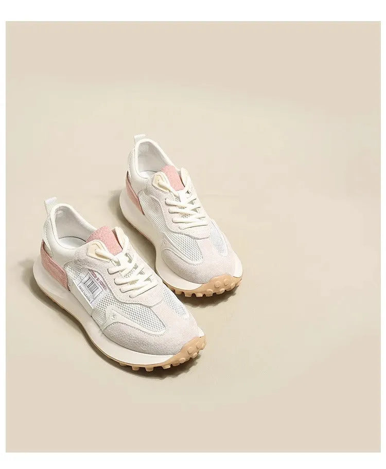 Women's grey and pink retro sneakers with low-top design and rubber soles