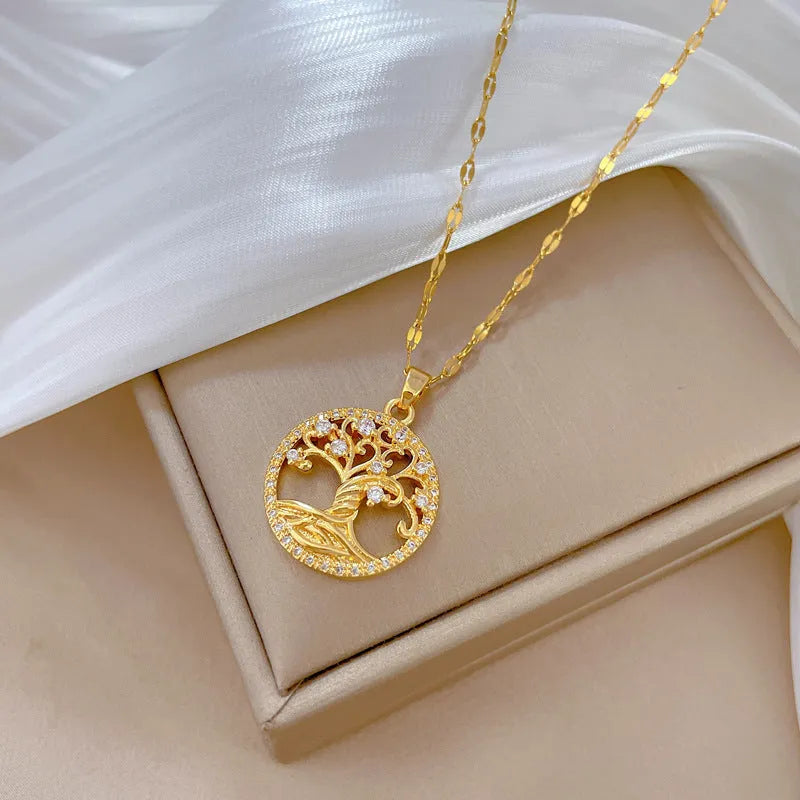 Gold-colour adjustable necklace with a mother-of-pearl pendant featuring a sparkling zircon lucky tree inlay.