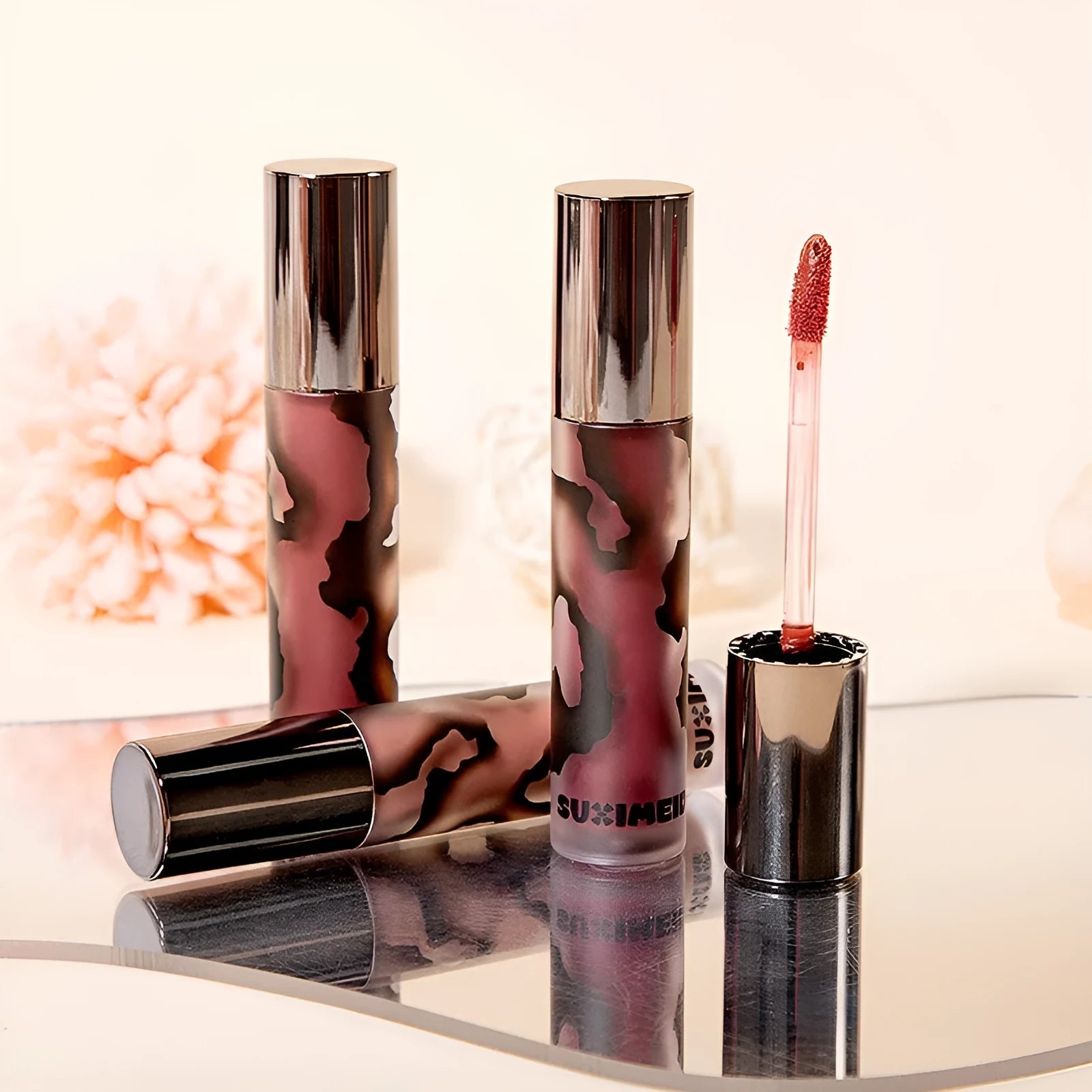 Matte liquid lipstick lip mud in five shades: orange brown, cool grey, cinnamon, jujube red, smoked purple.