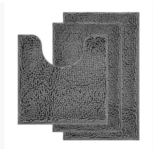 Chenille U-shaped three-piece bathroom carpet set in green beside a toilet.