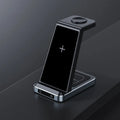 Black three-in-one wireless charger with phone watch and earbuds on charging pad