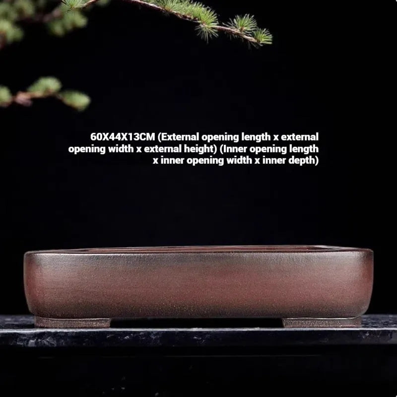 Handmade antique rectangular purple clay flower pot showing its size and natural colour.