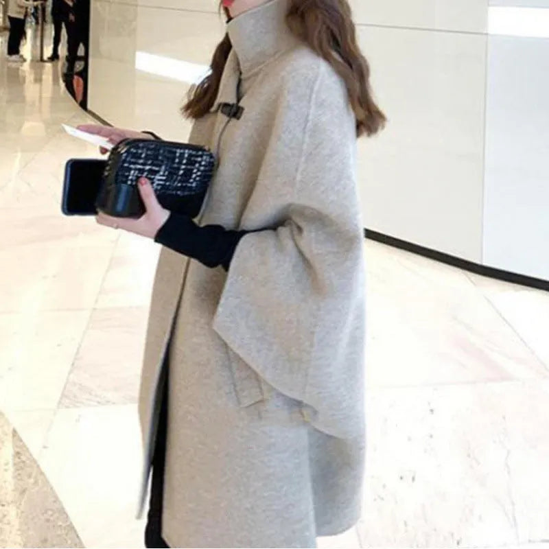 Women's oatmeal coloured acrylic coat with flight sleeves and a long 100cm length.