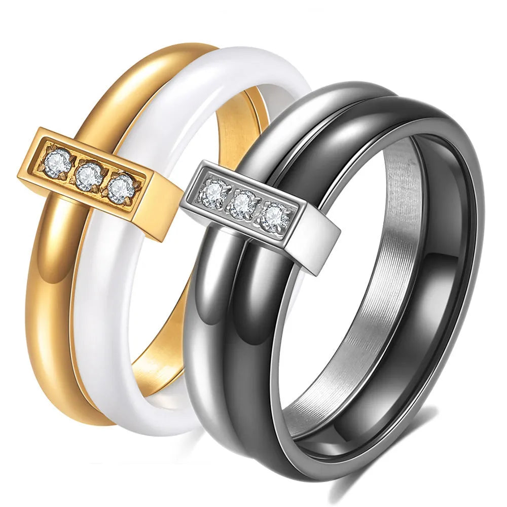 Close-up of a women's black ceramic ring with a geometric stitch pattern on a 6mm wide band, showcasing glossy finish.