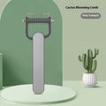 Green and grey dog unknotting combs in large and small sizes on a plain background.