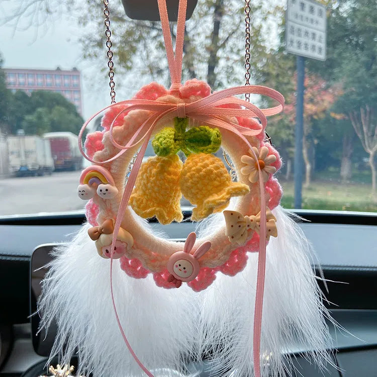 Woven wool bell orchid car pendant in green, pink, purple, or yellow, some with dream catcher.