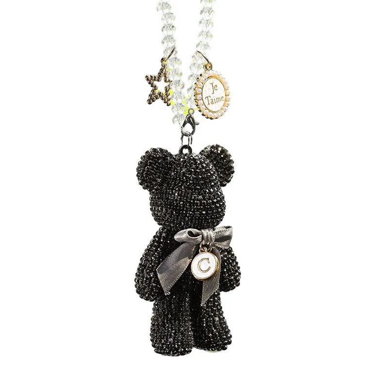 Violent Bear character car rearview mirror pendant with sparkling rhinestones on a black background.