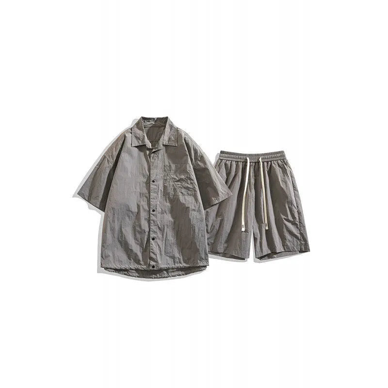 Men's loose casual shirt and matching shorts two-piece set in a light grey colour.