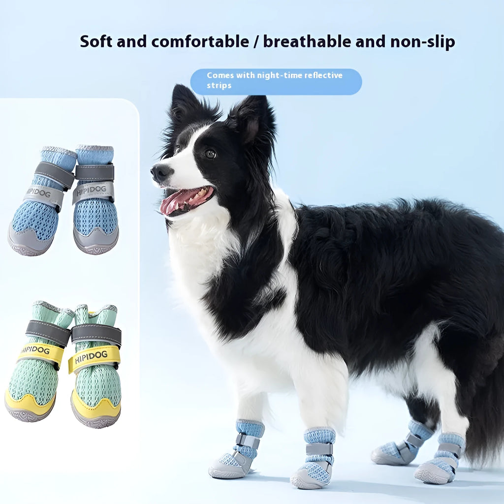 Pair of blue and green breathable mesh dog shoes with thick rubber soles and hook-and-loop straps on a wooden floor.