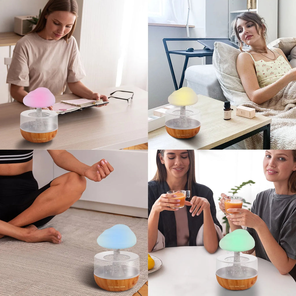 White cloud-shaped humidifier and essential oil diffuser with coloured mood light on.