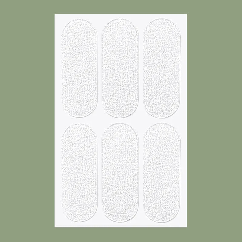 Transparent disposable ear patches on backing paper showing 0.1cm thickness and frosted/clear colour options
