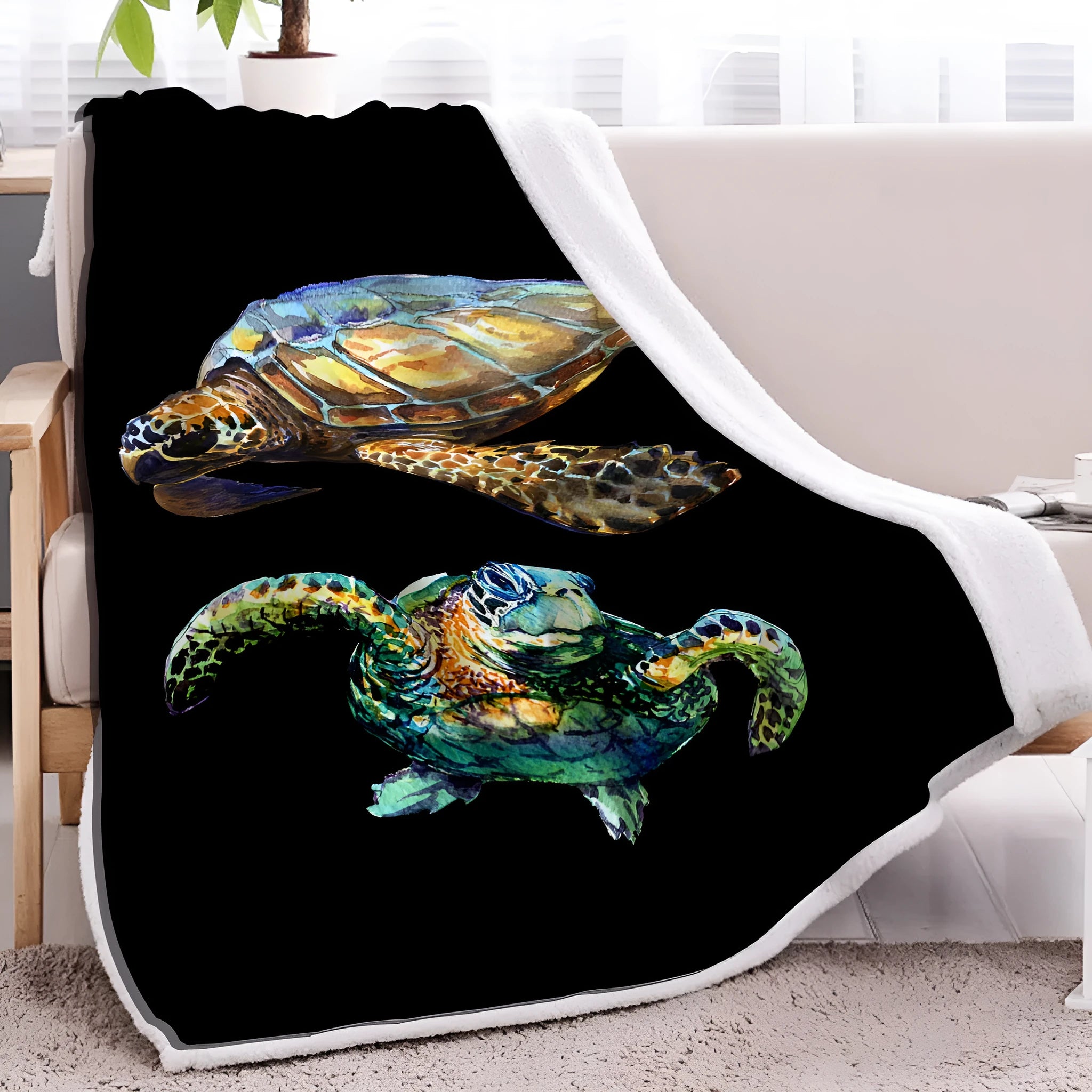 Black turtle pattern Sherpa fleece blanket on sofa, soft warm throw for home or camping