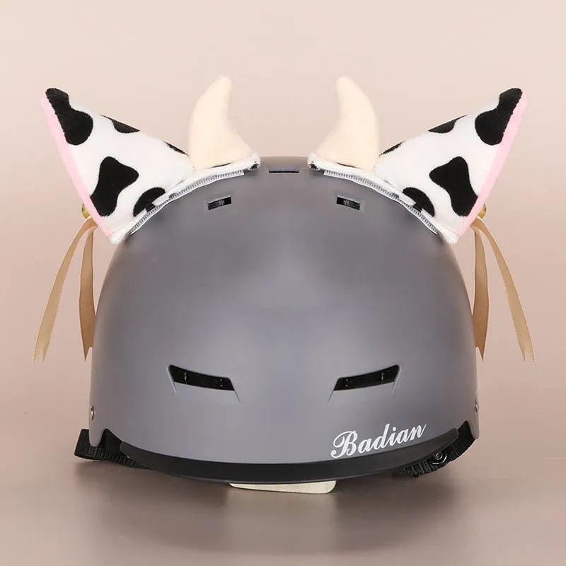 A soft plush cartoon character cover stretched over a medium-sized motorcycle helmet.