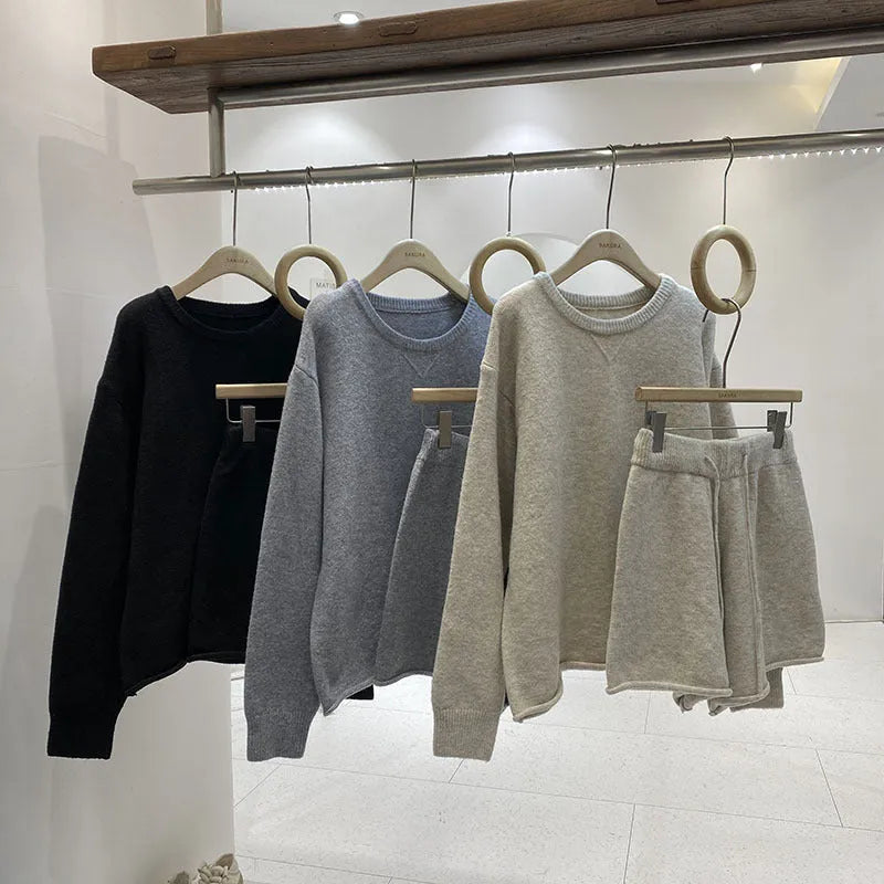 Women's loose-fit long sleeve acrylic knit sweater and matching wide-leg shorts set shown in oatmeal colour.