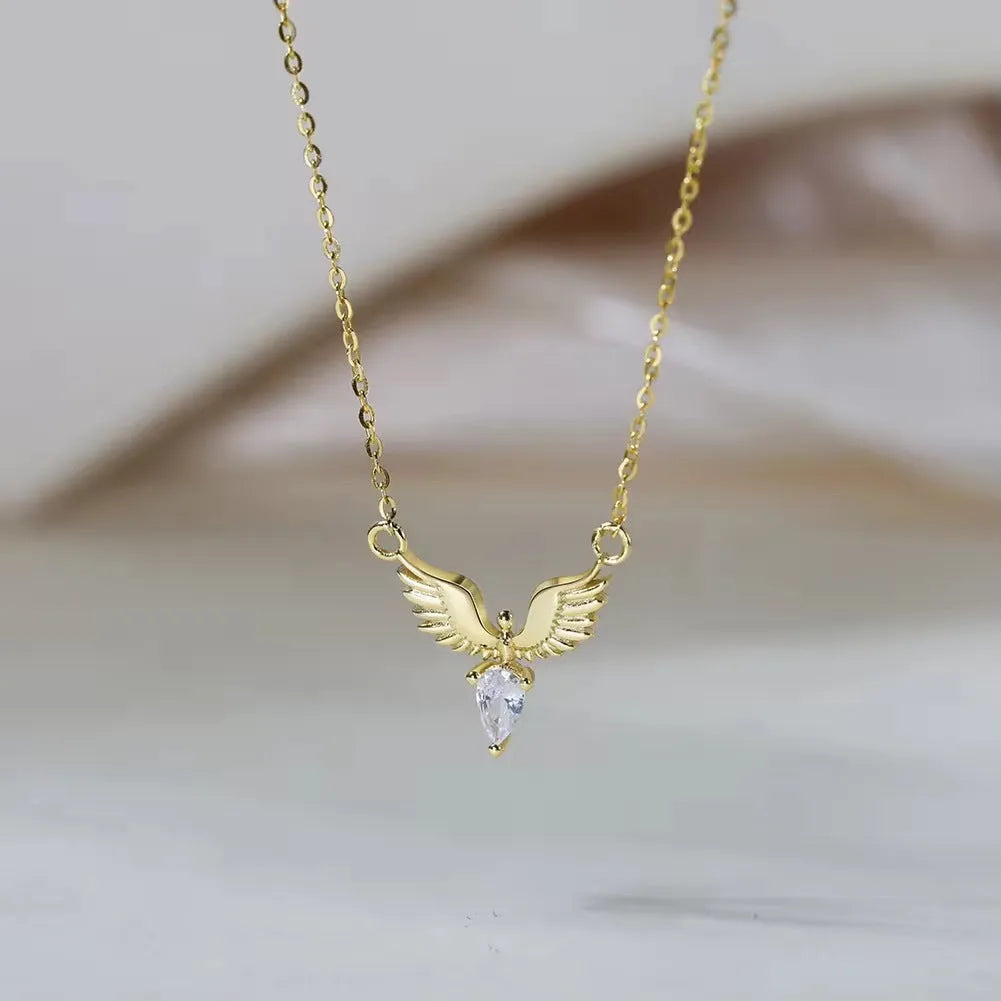 Close-up of a women's adjustable silver necklace with an eagle pendant on an O-ring chain, showing white gold and yellow gold colour options.