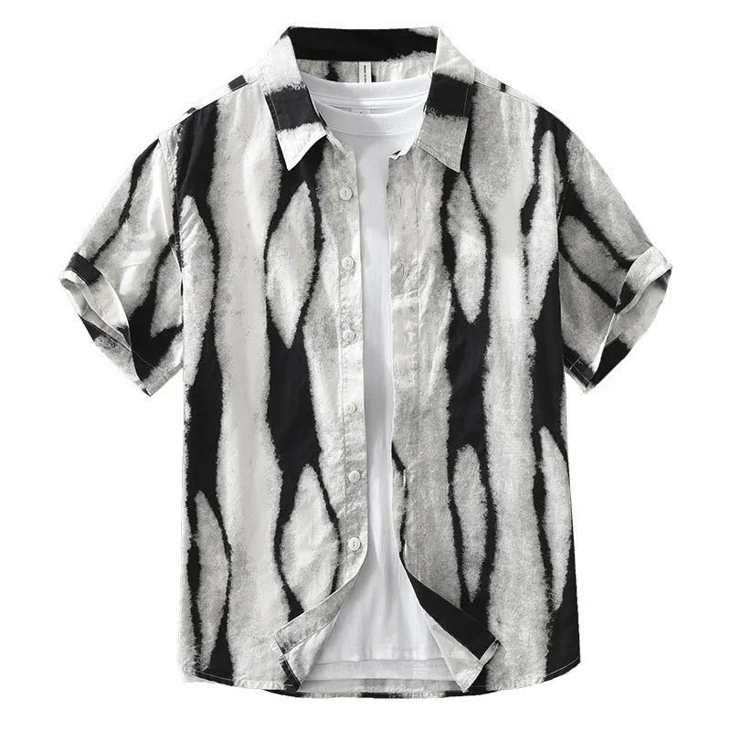 Man wearing a black and white retro striped short sleeve loose-fit cotton shirt.