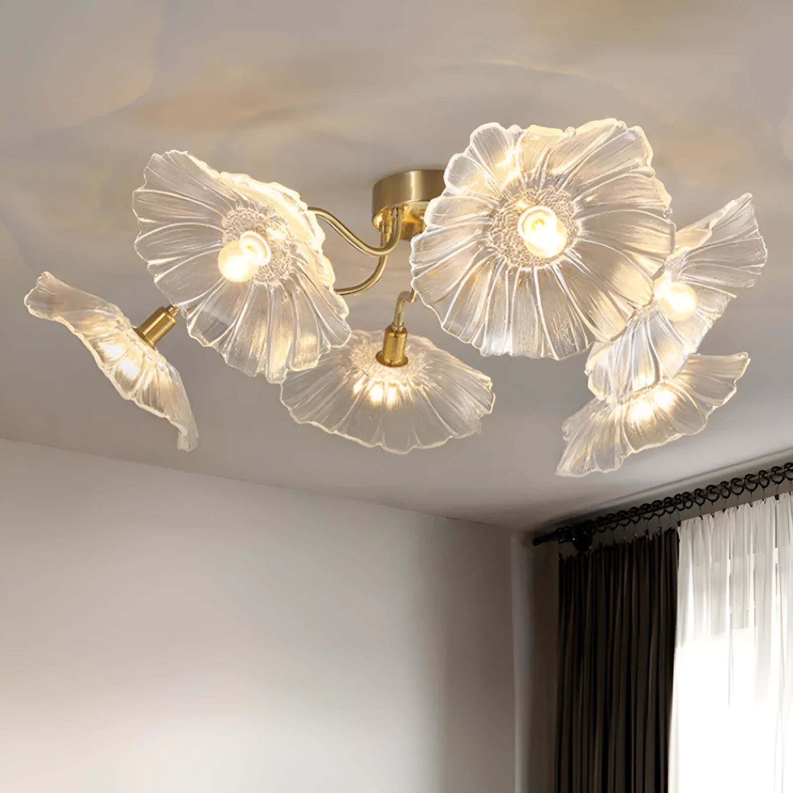 A modern white or purple flower-shaped LED ceiling lamp with five or six heads, mounted on a ceiling.