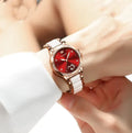 Olevs women's ceramic watch with luminous hands, rose shell blue dial, and matching ceramic band