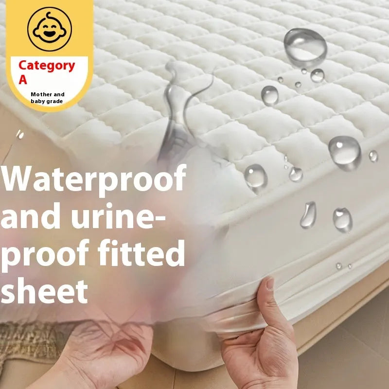 Class A waterproof fitted sheet in washed cotton, shown in a neutral colour on a bed.