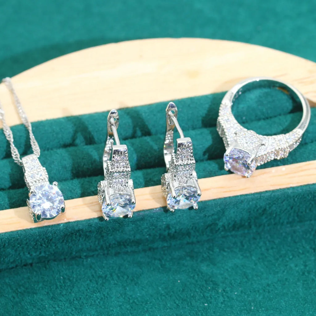 Four-piece bridal jewellery set showing necklace, bracelet, earrings and ring with alloy pendant and water wave chain