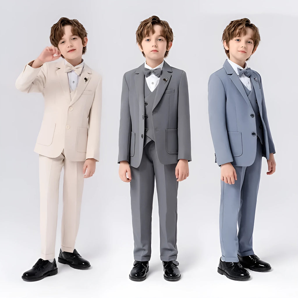 Boy's solid colour British style suit dress set with coat, trousers, vest, bow tie, and brooch on a hanger