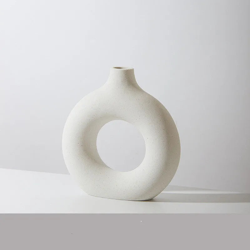 A simple modern frosted porcelain biscuit vase for flower arranging, shown in a neutral colour.