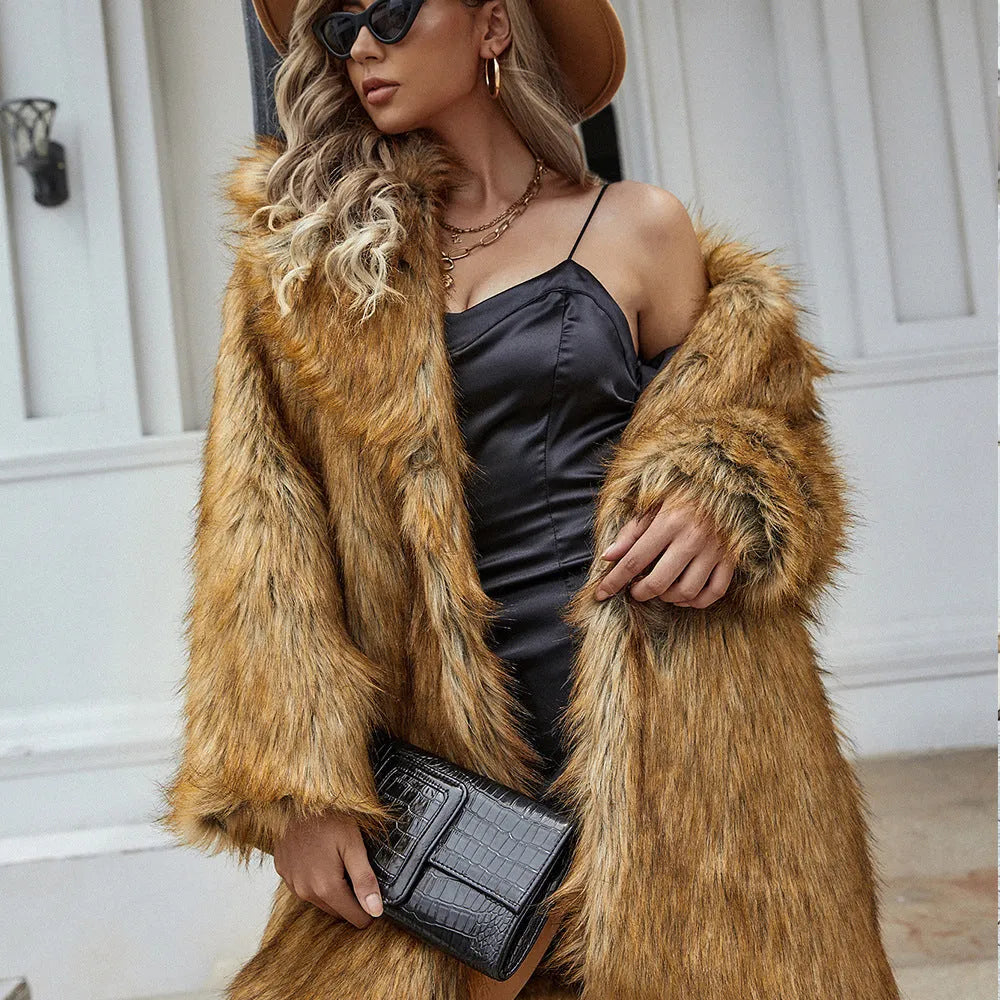 Yellow loose-fit women's faux fur coat on a hanger, showing mid-length design and plush texture.