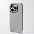 Genuine leather iPhone case with magnetic metal ring around camera lenses, shown in black.