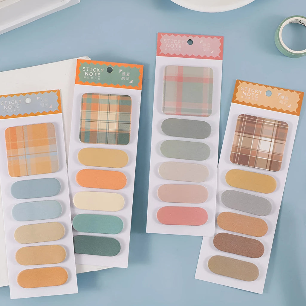 Pack of colourful sticky notes showing eight different colour covers including blue, green, and pink designs.