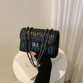 Small beige retro textured diamond pattern PU crossbody bag with a single strap, shown next to a mobile phone for scale.