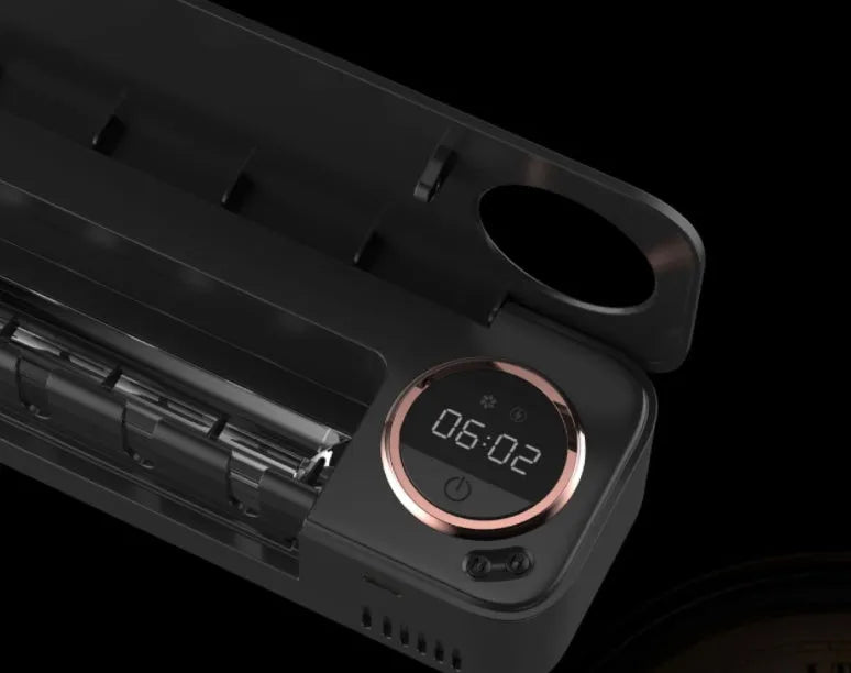 UV toothbrush holder steriliser with LED display attached to wall, showing countdown, black colour