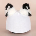 A soft plush cartoon character cover stretched over a medium-sized motorcycle helmet.