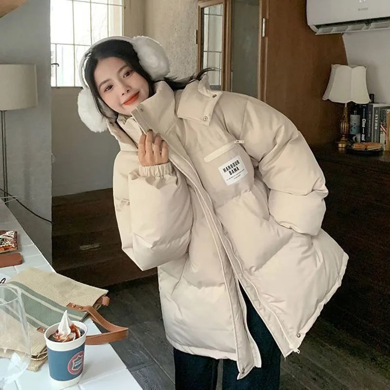 Women's Korean-style loose cropped jacket in solid colour beige, with long sleeves and contrast stitching