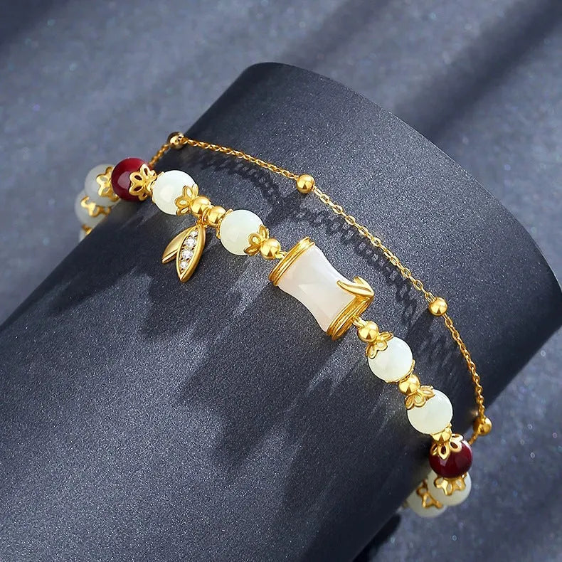 Glass and coloured glaze bracelet with floral design and ruyi elements in retro style