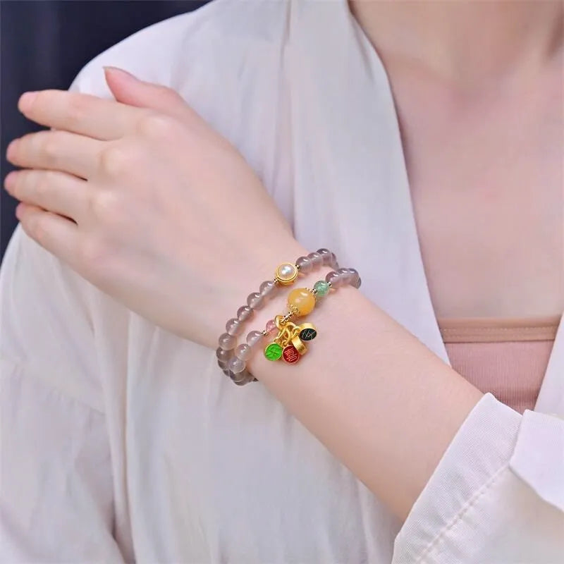 Natural grey agate bracelet with safe and happy motif, retro two-circle design on adjustable cord.
