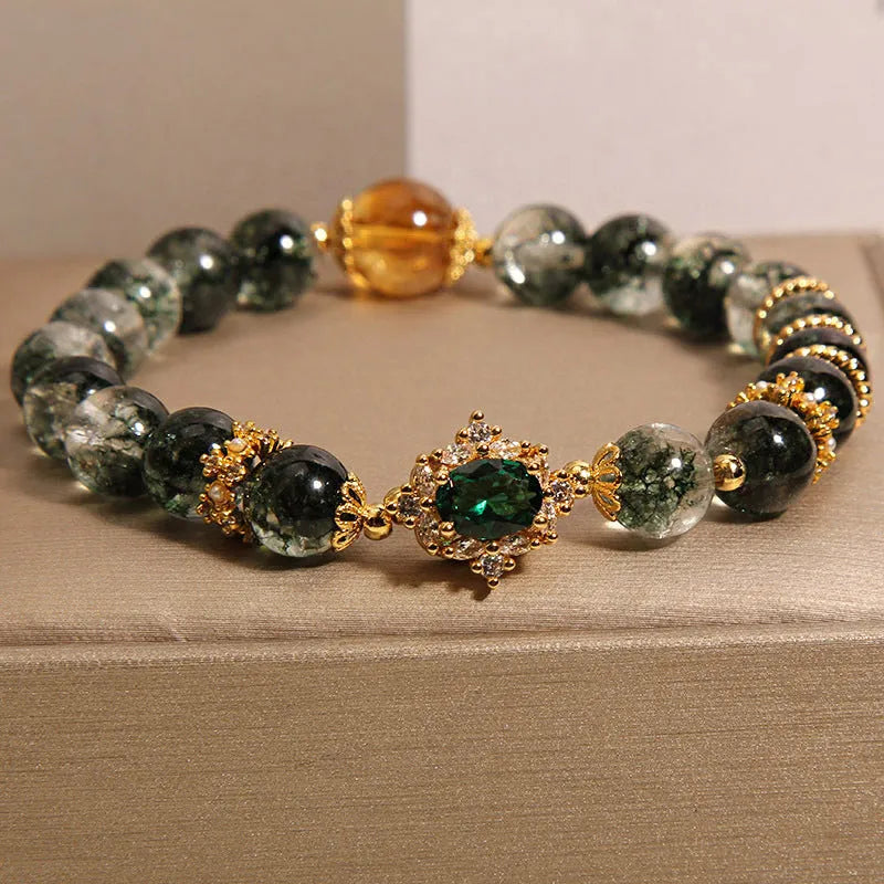 Women's green phantom quartz crystal bracelet with gold rutile needle inclusions and rhinestone accents
