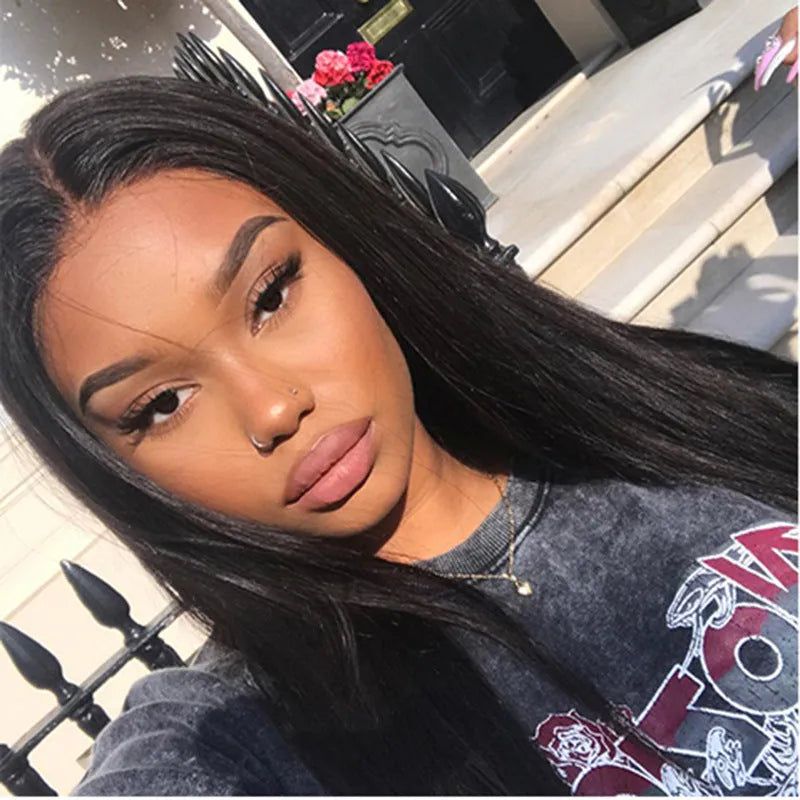 Long straight synthetic wig for women with centre-parted bangs in black colour.