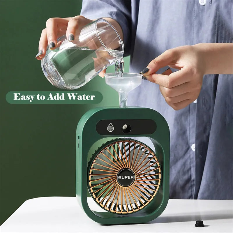 Green and white USB rechargeable portable desk fan with misting humidifier function and adjustable wind direction.
