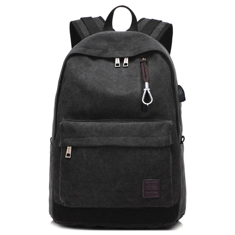 Canvas backpack with USB charging port shown in grey colour, featuring multiple pockets and straps.