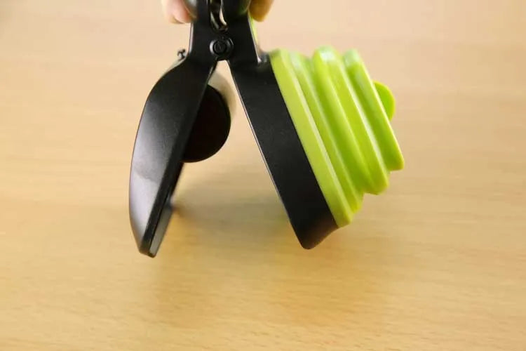 Foldable dog pooper scooper with one-handed grip and biodegradable bag roll in blue