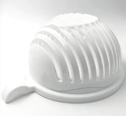 Blue salad cutter bowl showing removable cutting lid placed on a base with a raised rim.