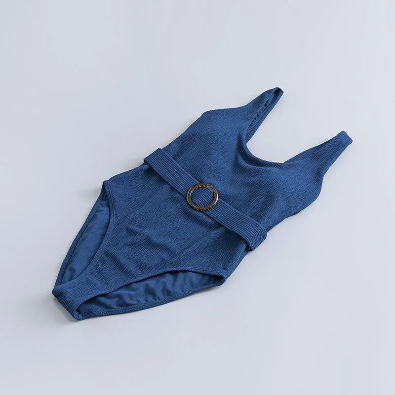 Navy blue women's one-piece swimsuit with triangle neckline and sleeveless design for swimming.