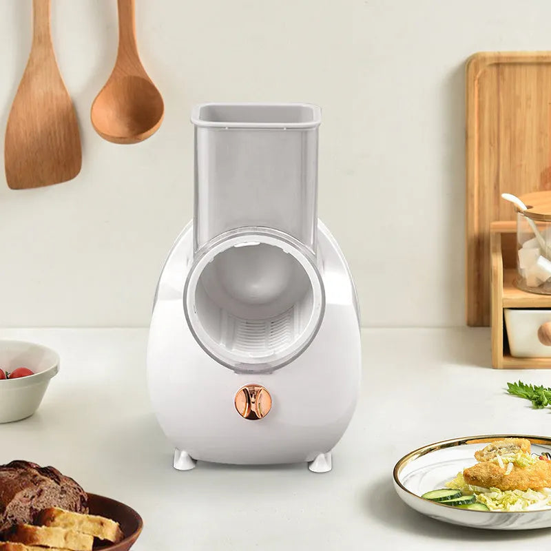 White electric vegetable slicer with suction base and interchangeable blades for potato carrot cutting