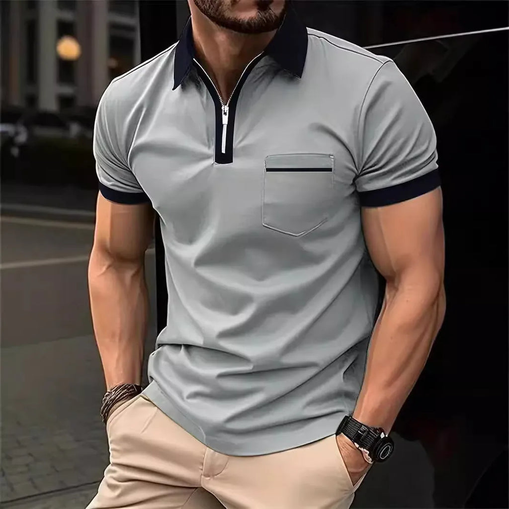 Man wearing a loose-fit men's short sleeve casual shirt with a chest pocket and zipper decoration.